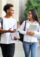 Two college students walking to class